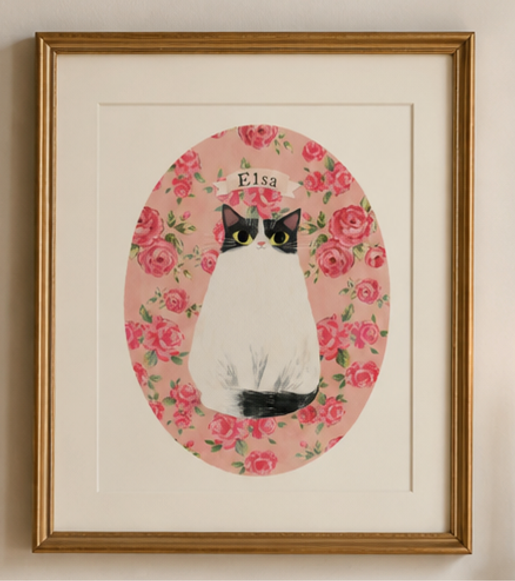 Framed artwork of a cat silhouette in a floral wreath with flowers and candles in the background.
